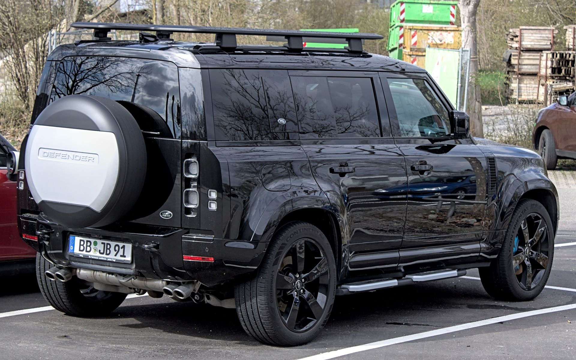 Land Rover Defender 110 V8 in black, rear three-quarter view