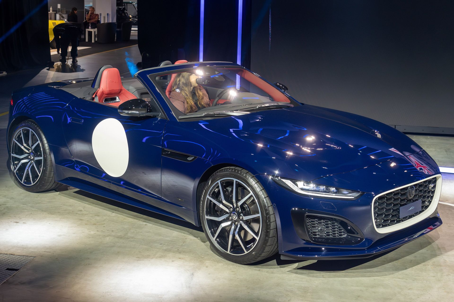 Jaguar F-TYPE convertible in deep blue under show lighting